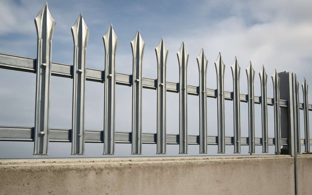 palisade fencing on top of wall